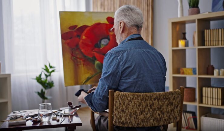 Elderly man painting